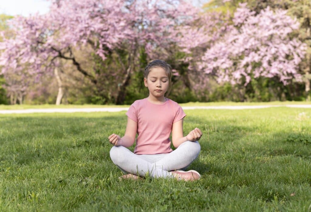 a kid doing yoga