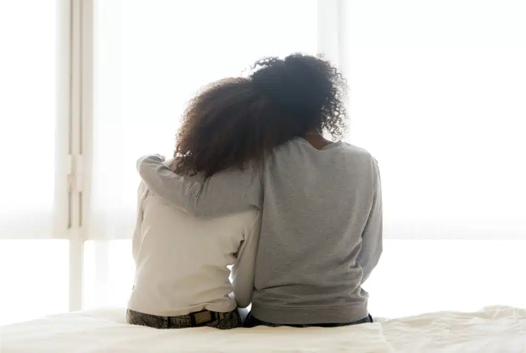 Mother holding daughter