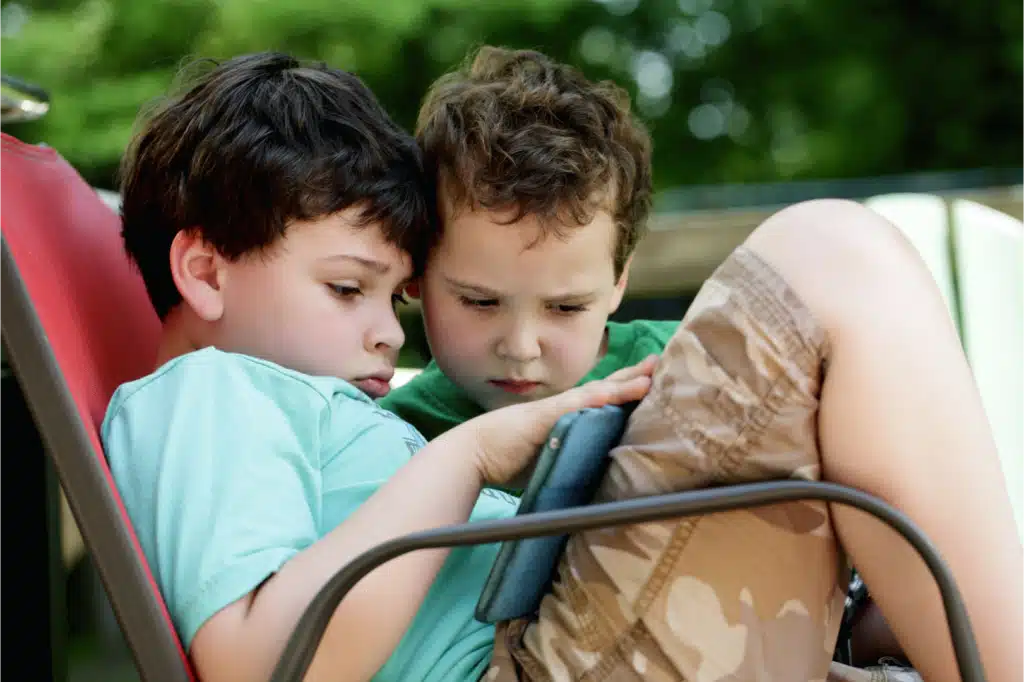 Two boys watching on an iPad